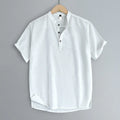 Men's solid colour short sleeve t-shirt in a cotton linen fabric blend on a hanger.
