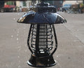 Black solar mosquito lamp with integrated solar panel for garden outdoor insect control