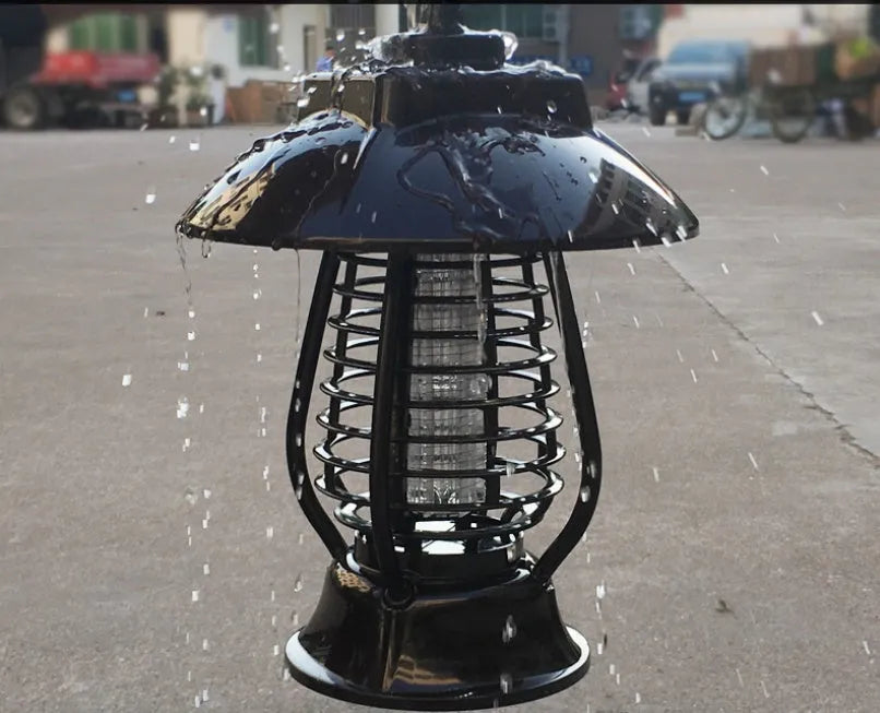 Black solar mosquito lamp with integrated solar panel for garden outdoor insect control