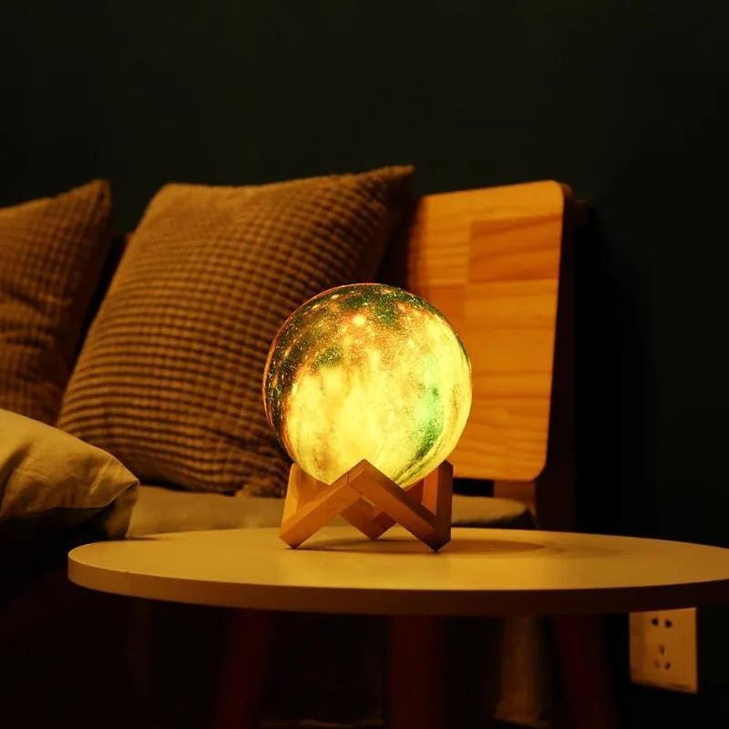 White 3D printed moon-shaped night light on a dark surface, demonstrating its textured surface and soft LED glow.