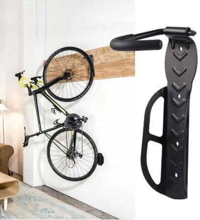 Black mountain bike wall mount bicycle storage rack on wall with front wheel on hook