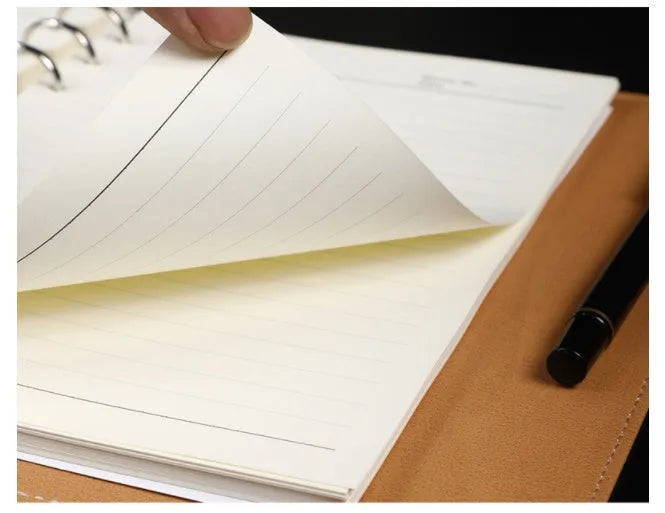 A5 hardcover PU binder notebook with metal buckle clip, shown in multiple colours.