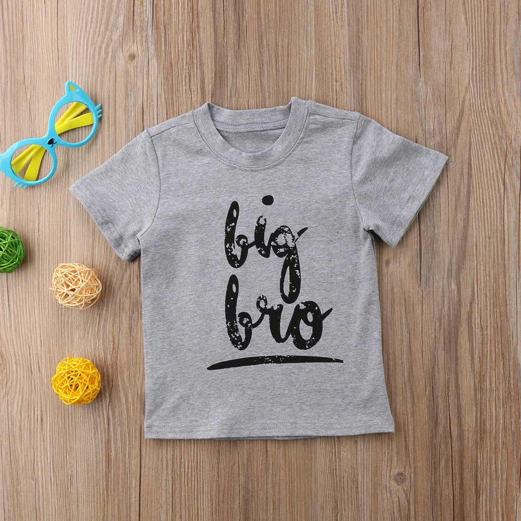 Grey cotton children's t-shirt with printed sibling graphic, showing size range from 60cm to 140cm.