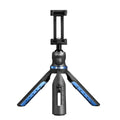 Black desktop tripod stand holding an iPhone X mobile phone.