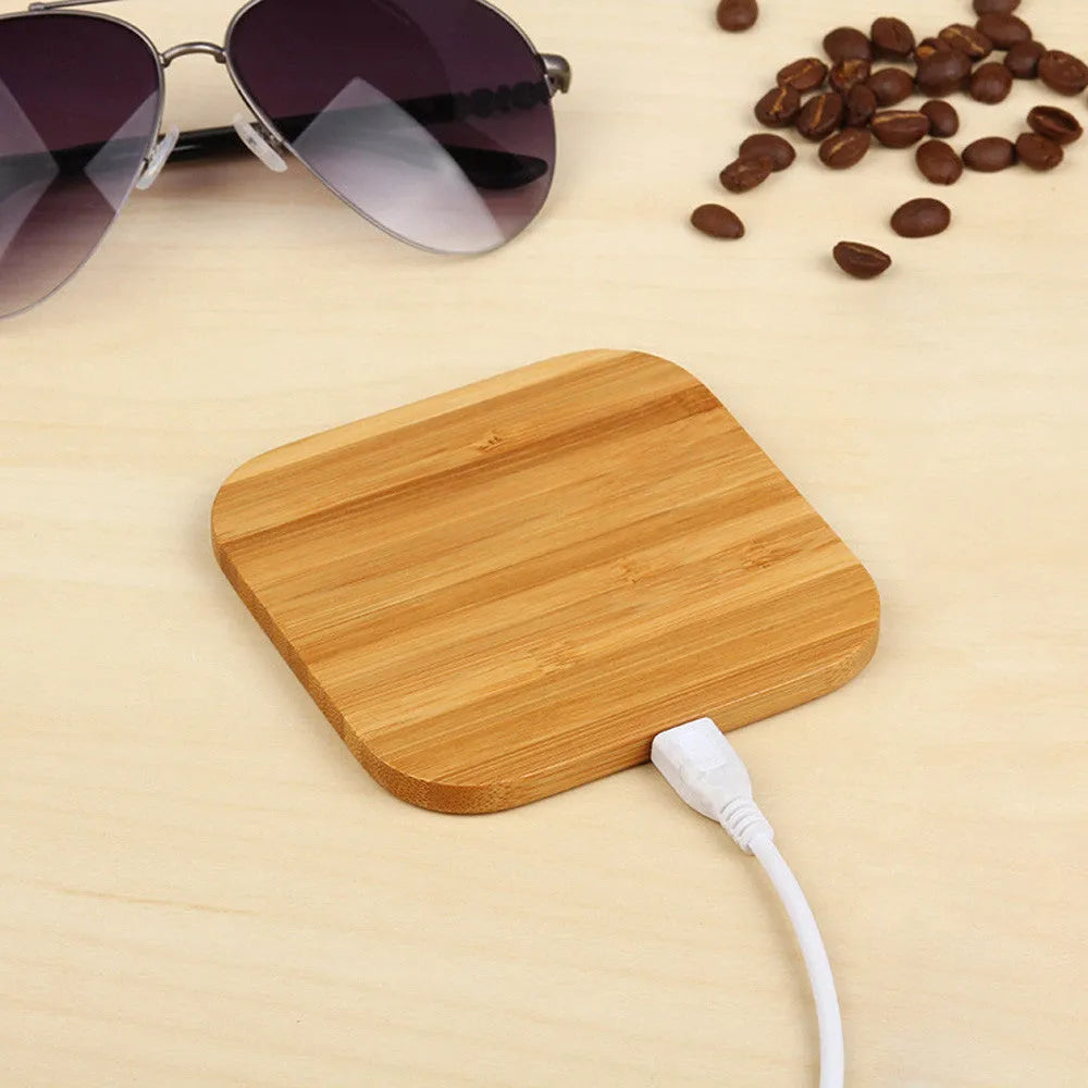 Square wooden bamboo 5W Qi wireless charging pad on a table