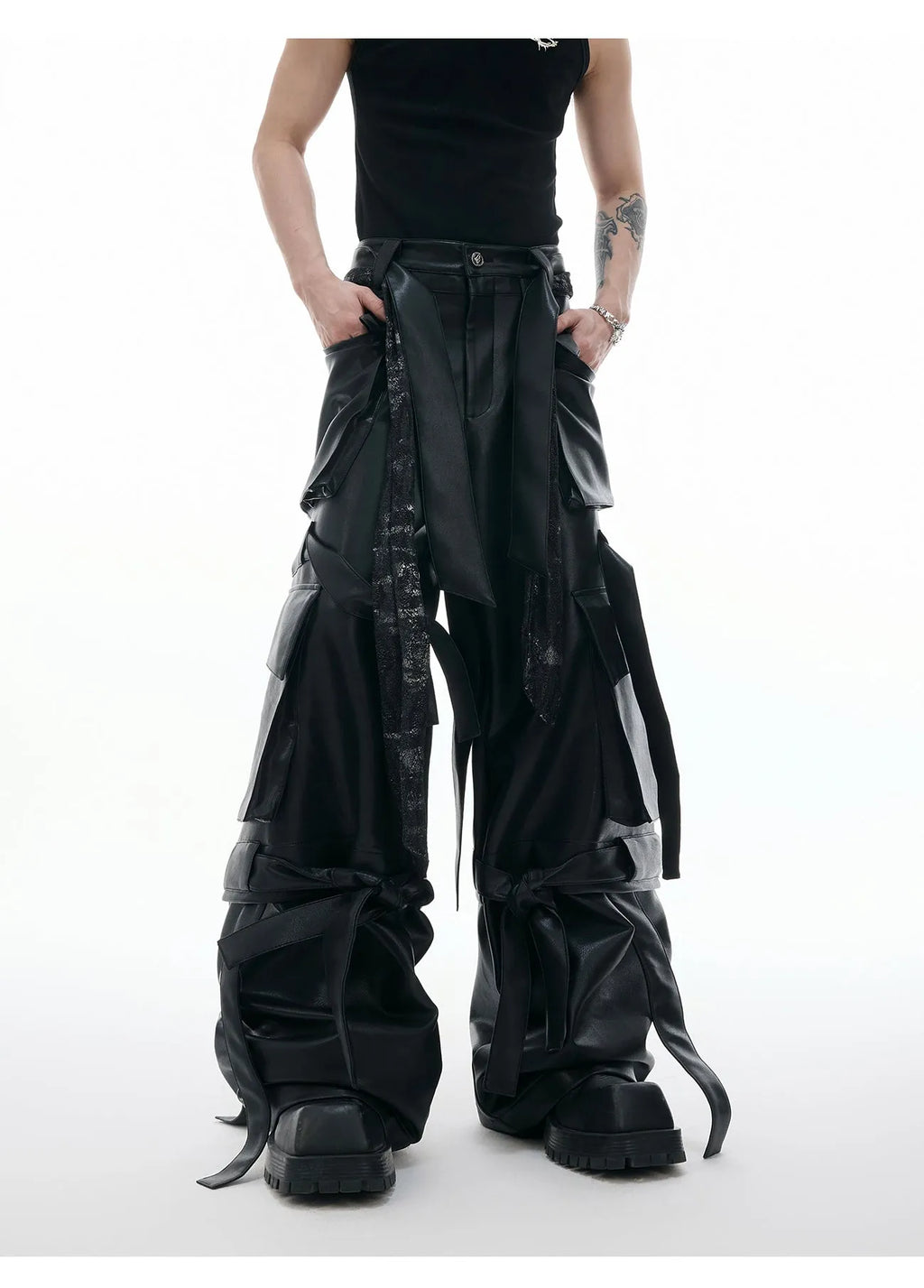 Black loose fit leather trousers with quilted stitching detail and multiple pockets