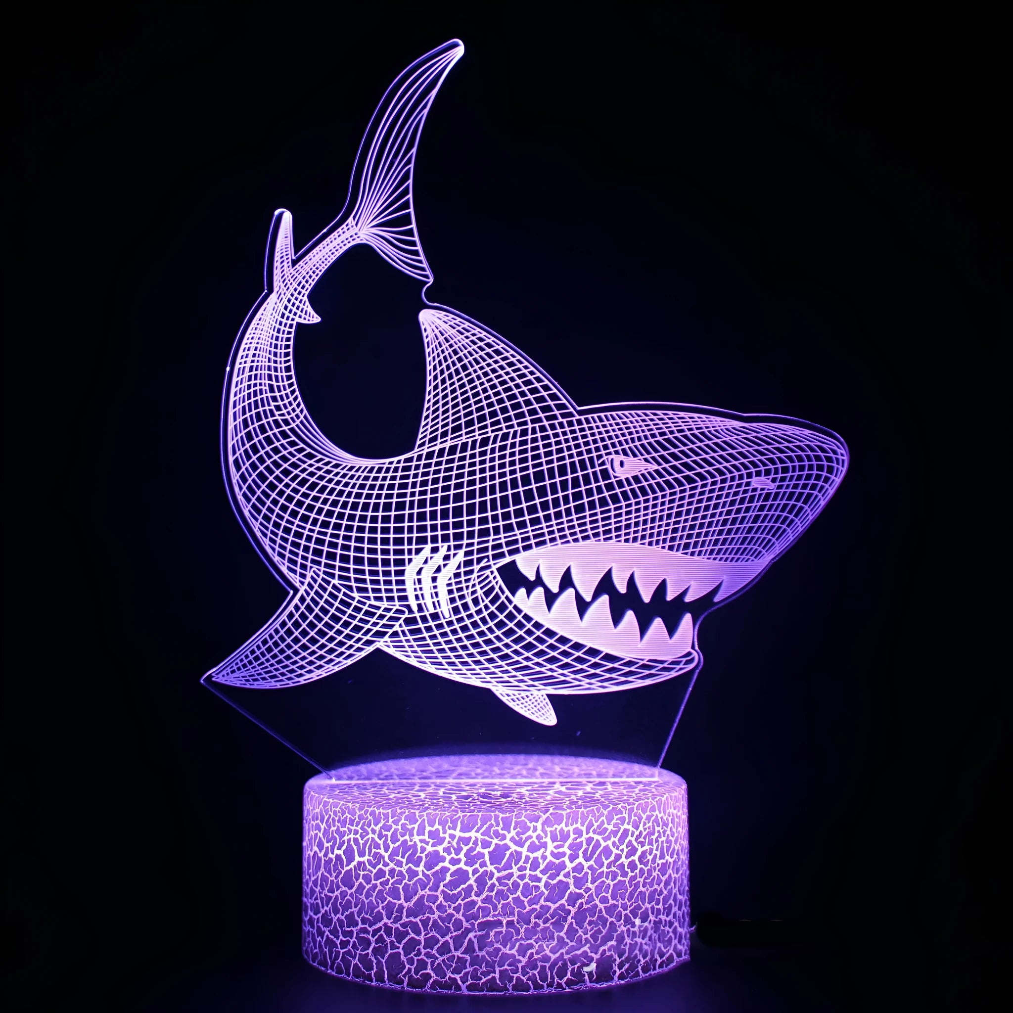 Shark-shaped 3D LED table lamp with colourful acrylic panel on a black ABS base.