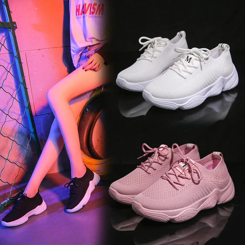 Women's white thick-soled sports shoes with a woven upper and front strap in a candy colour.