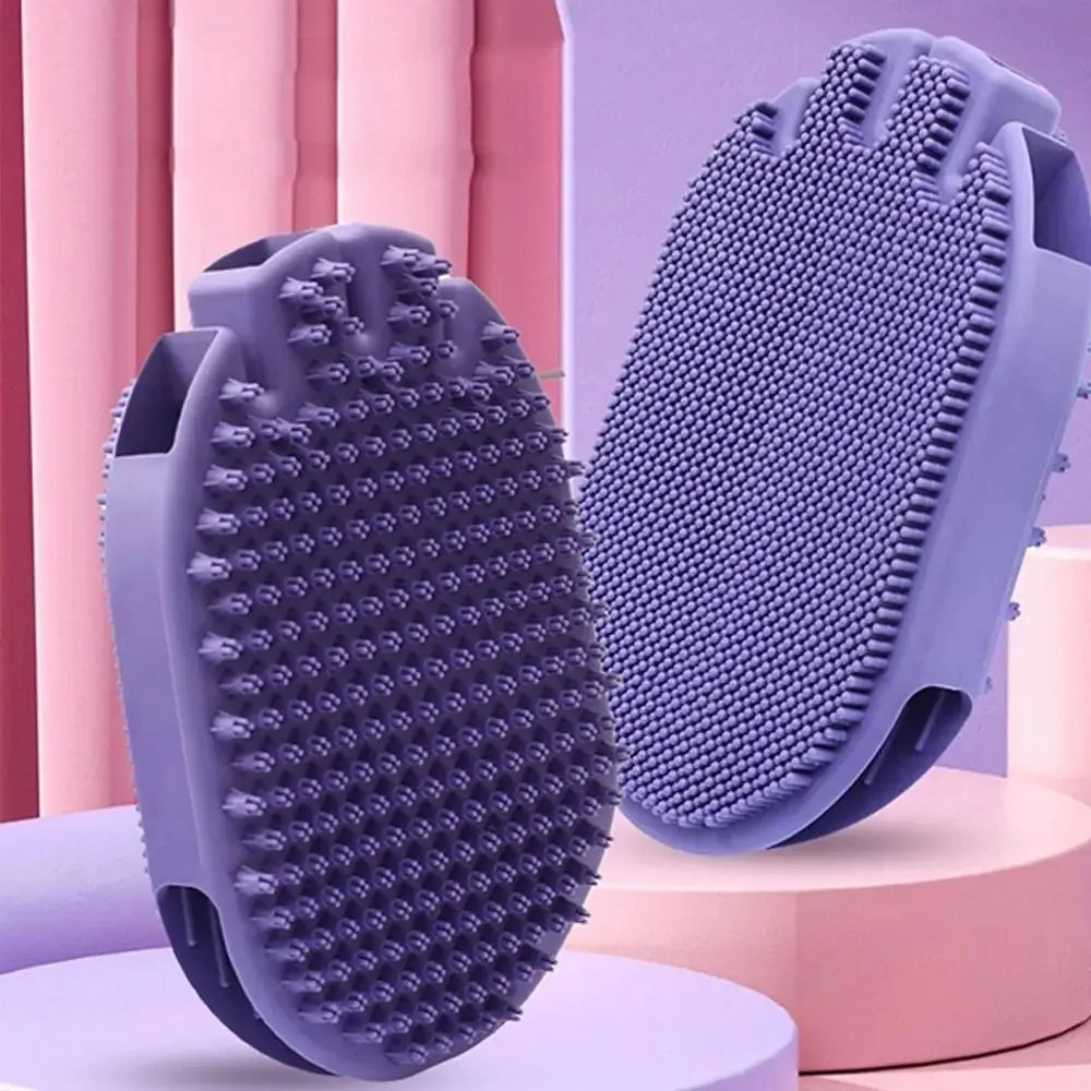 Purple dual-sided pet shampoo massage brush with soft TPR bristles and ergonomic handle.