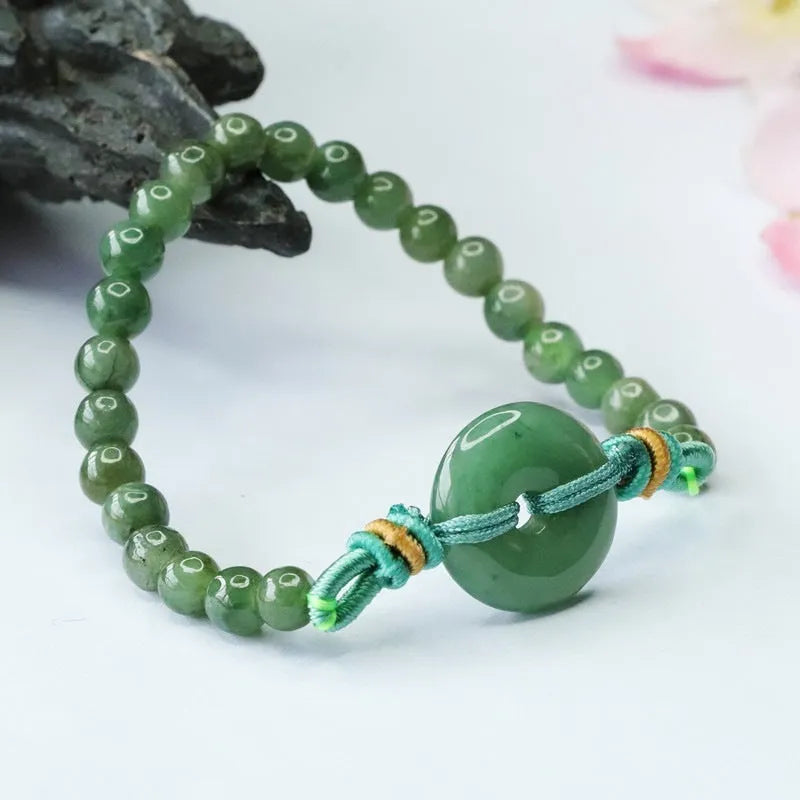 Emerald green jade bracelet with peace buckle clasp and star design elements