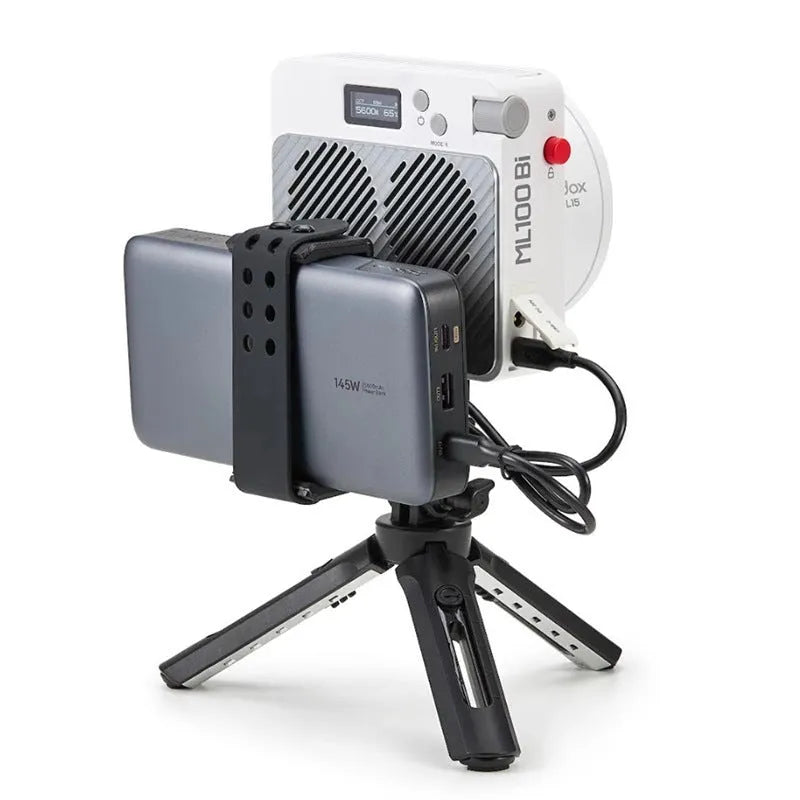 Shenniu ML100Bi photography fill light with aluminium body, two lenses, battery handle, and storage bag.