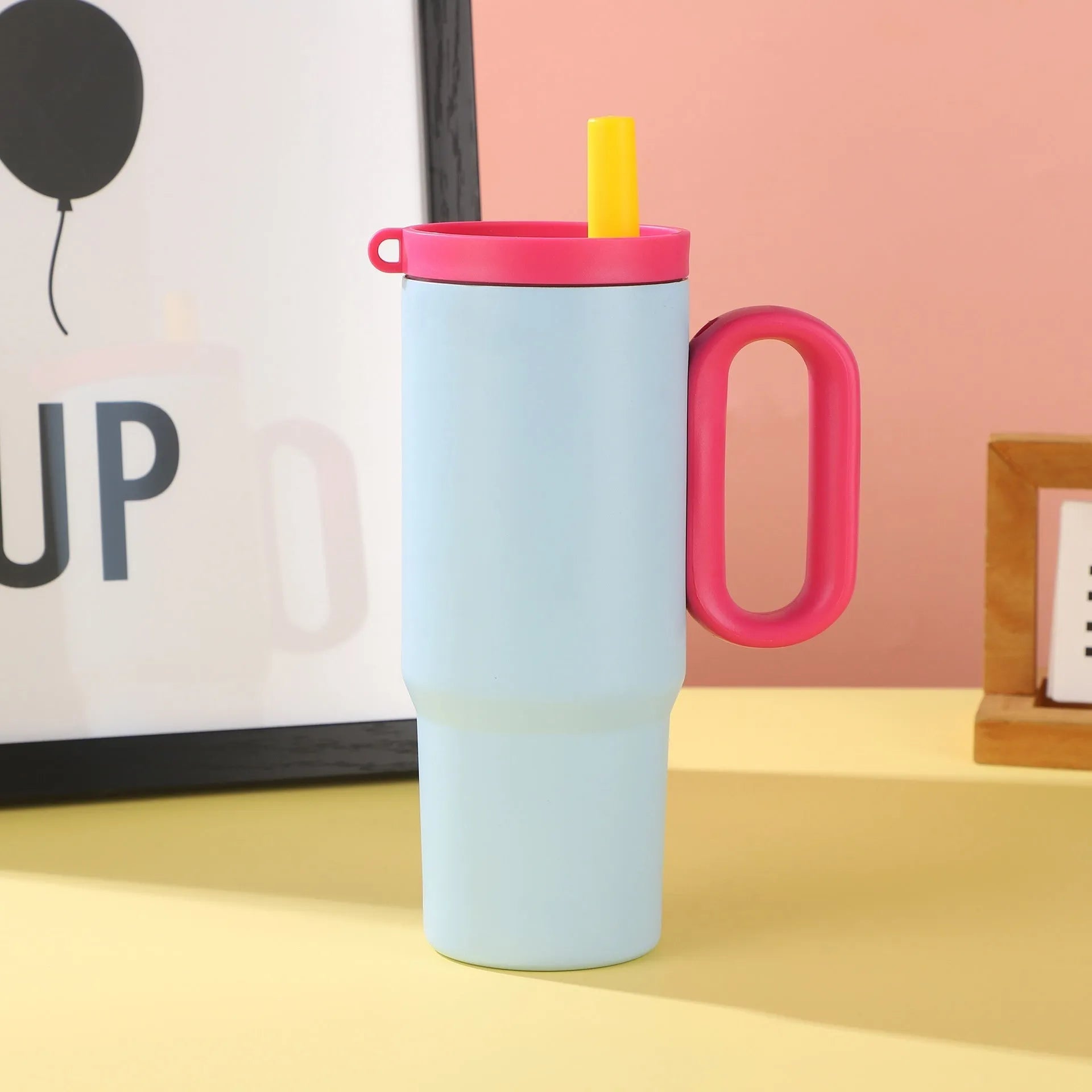 Large 700ml straw cup with a carry handle in assorted colours.