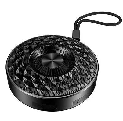 Compact black, orange, and silvery white portable Bluetooth speaker on a table