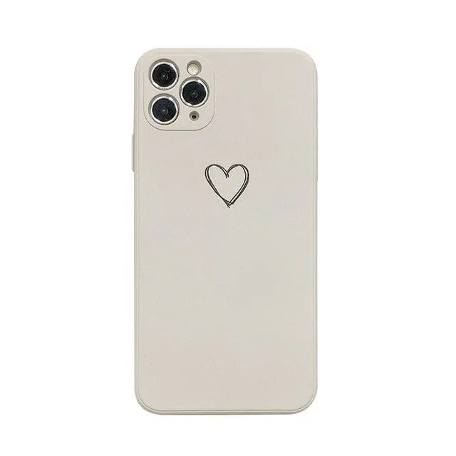 Silicone phone case for Apple iPhone in multiple solid colour options including black, pink, and purple
