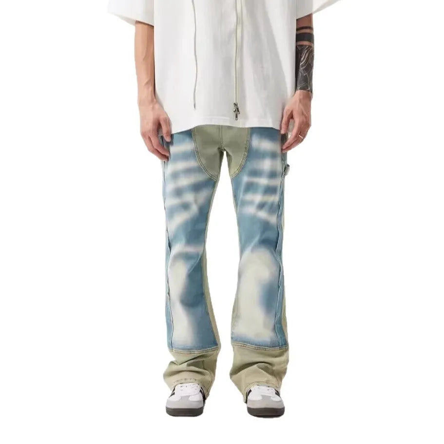 Retro yellow and blue patchwork splash-ink damaged design denim jeans on a mid-waist fit.