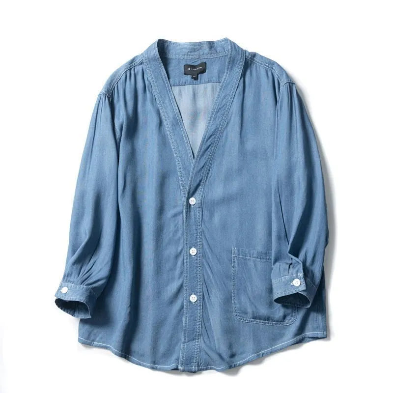 Men's dark blue casual denim coat with V-neck collar and chest pocket on a hanger.