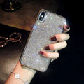 Silver glitter diamond pattern silicone phone case with crystals for iPhone.