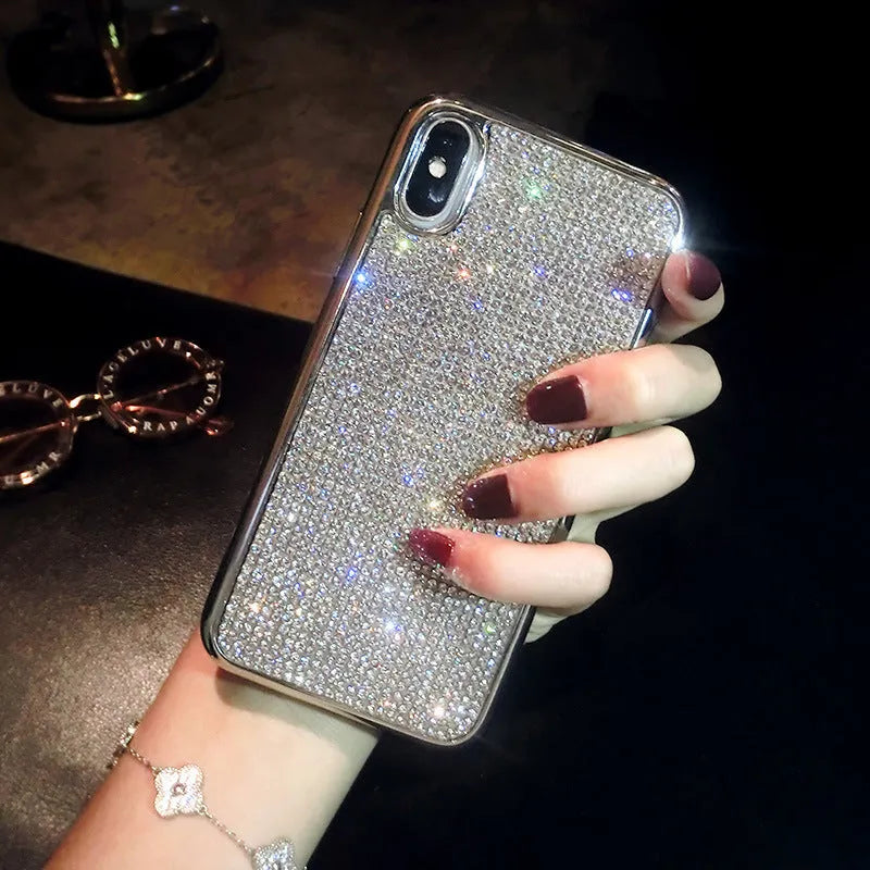 Silver glitter diamond pattern silicone phone case with crystals for iPhone.