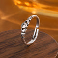 Retro silver heart open ring on finger showing adjustable copper construction and heart silhouette