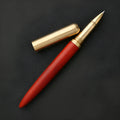 Brass and sandalwood signature pen with wooden barrel, shown alongside a ruler indicating 14 cm length.