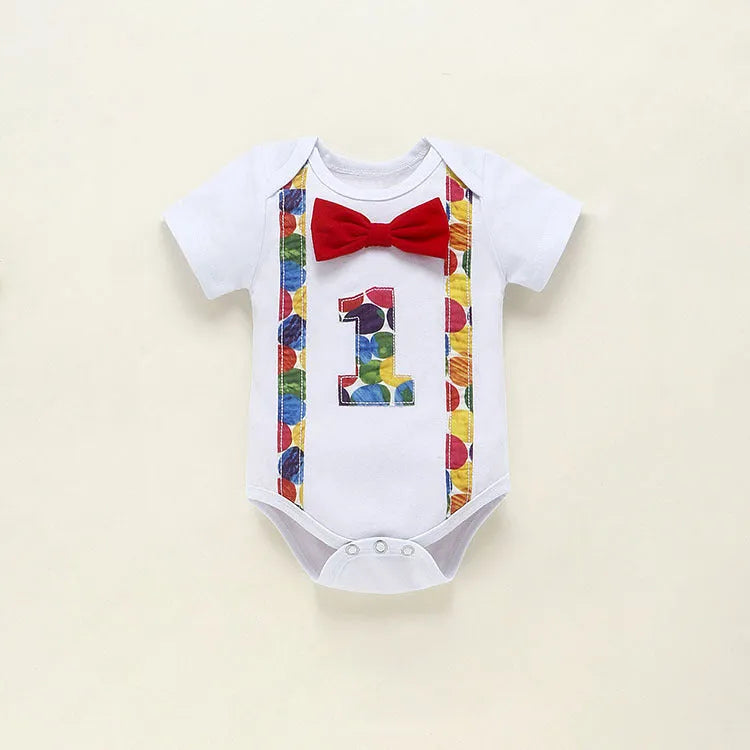 Baby in a soft cotton dinosaur print romper with shorts, showing the pullover design and clean finish.