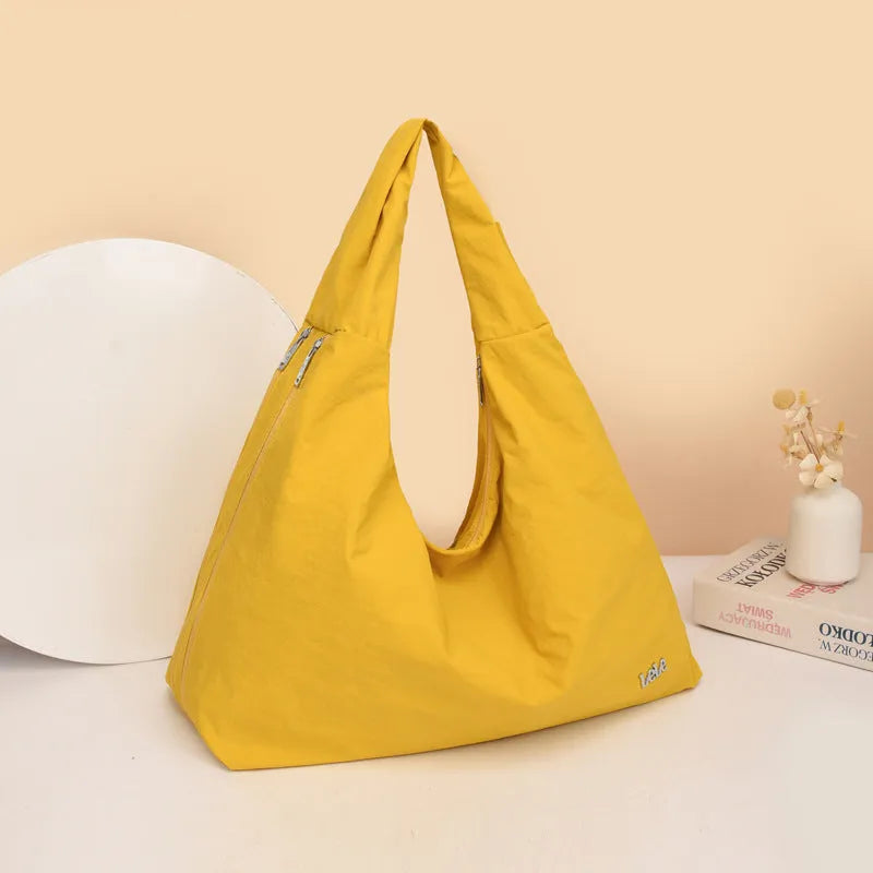 Women's heart-shaped nylon underarm bag in black, blue, khaki, and yellow colour options
