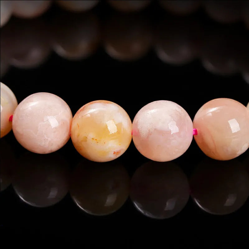 Natural cherry agate bracelet with round geometric beads in a sweet style for women.