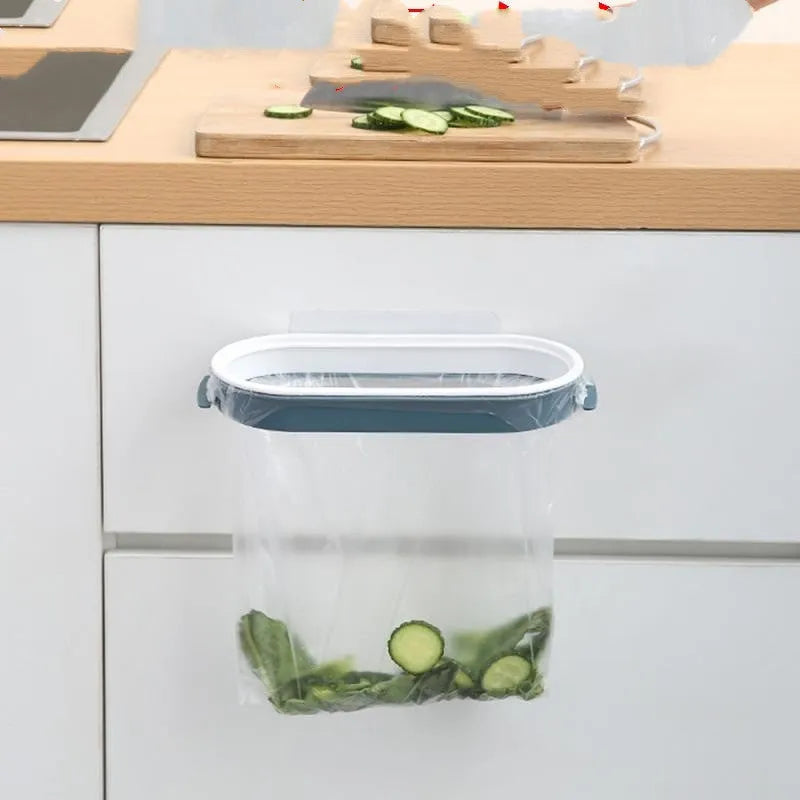 Blue plastic kitchen garbage bag storage rack mounted on wall