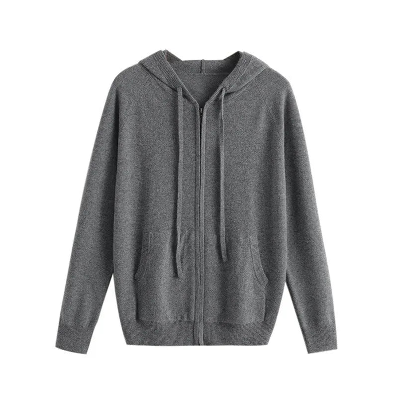 Man wearing a haze blue hooded zip-front cashmere knit cardigan in a casual setting.