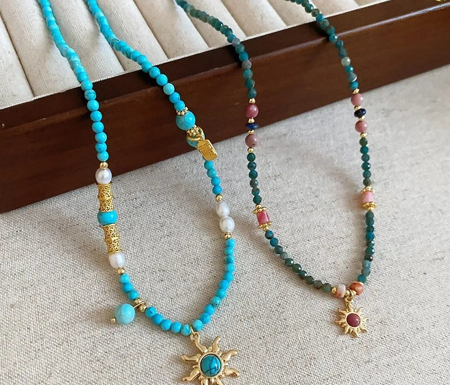 French court style freshwater pearl necklace with sun pendant on adjustable clavicle chain