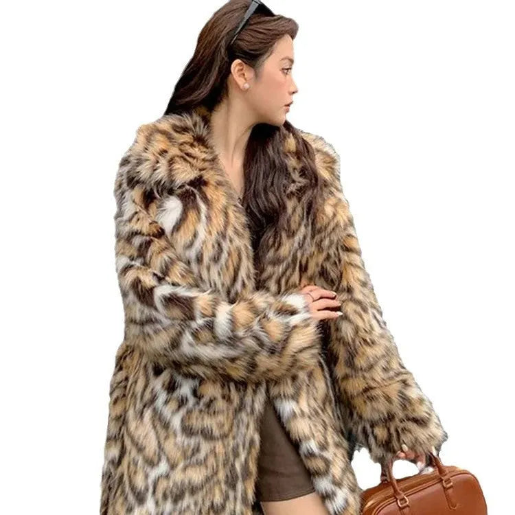 Faux fur coat with detachable collar in street fashion style showing long length and practical pockets
