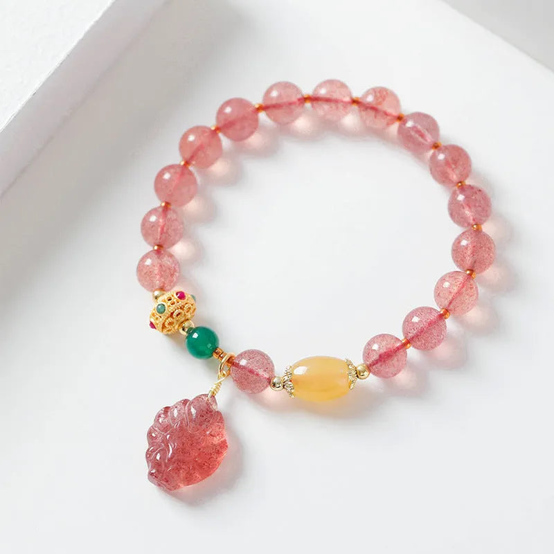 Women's crystal bracelet with strawberry quartz beads in nine tail fox design