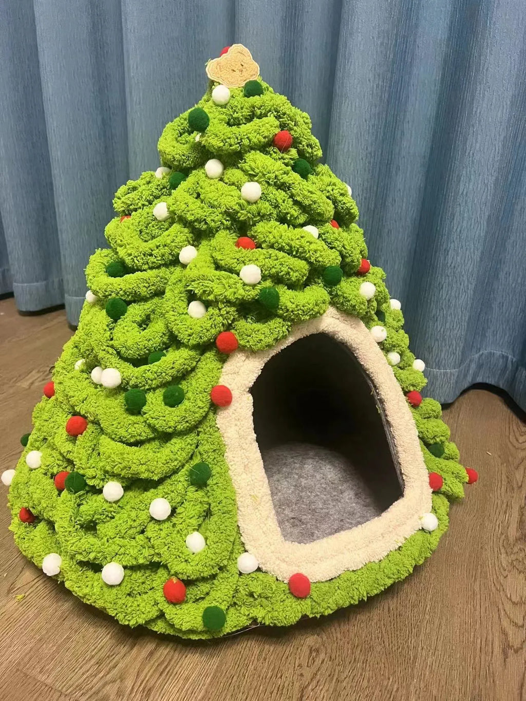 Grey handmade felt cone-shaped cat house with enclosed tent-style design