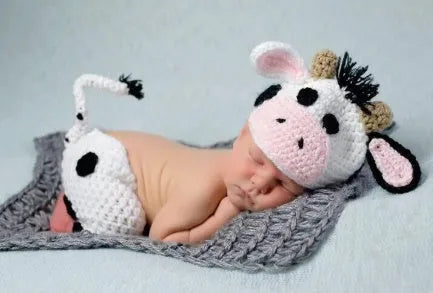 Hand-knitted white newborn cow suit with matching hat and trousers for 0-3 month babies