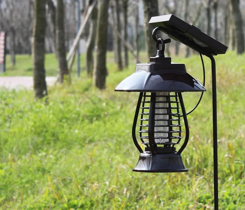 Black solar mosquito lamp with integrated solar panel for garden outdoor insect control