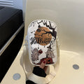 Women's black mini crossbody bag with orange Halloween pumpkin graffiti print.