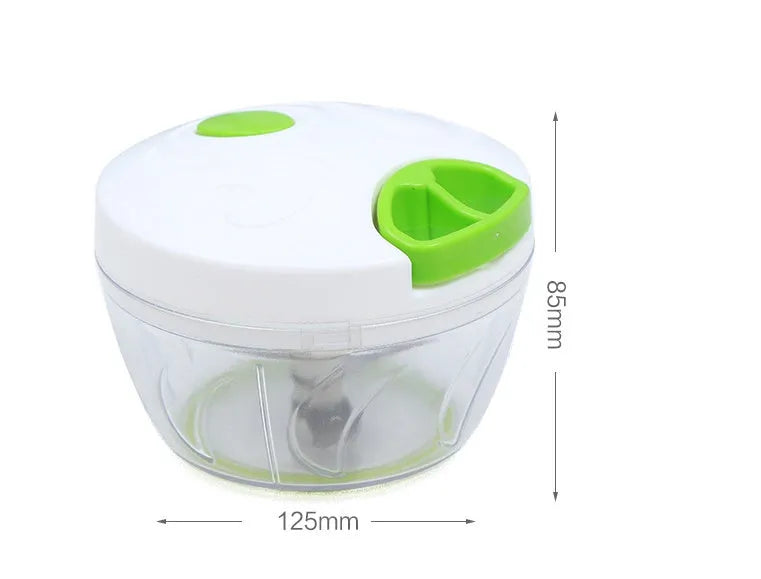 Green manual kitchen chopper with lid, showing stainless steel blades inside, on a countertop.