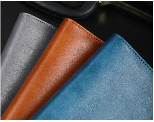 A5 hardcover PU binder notebook with metal buckle clip, shown in multiple colours.