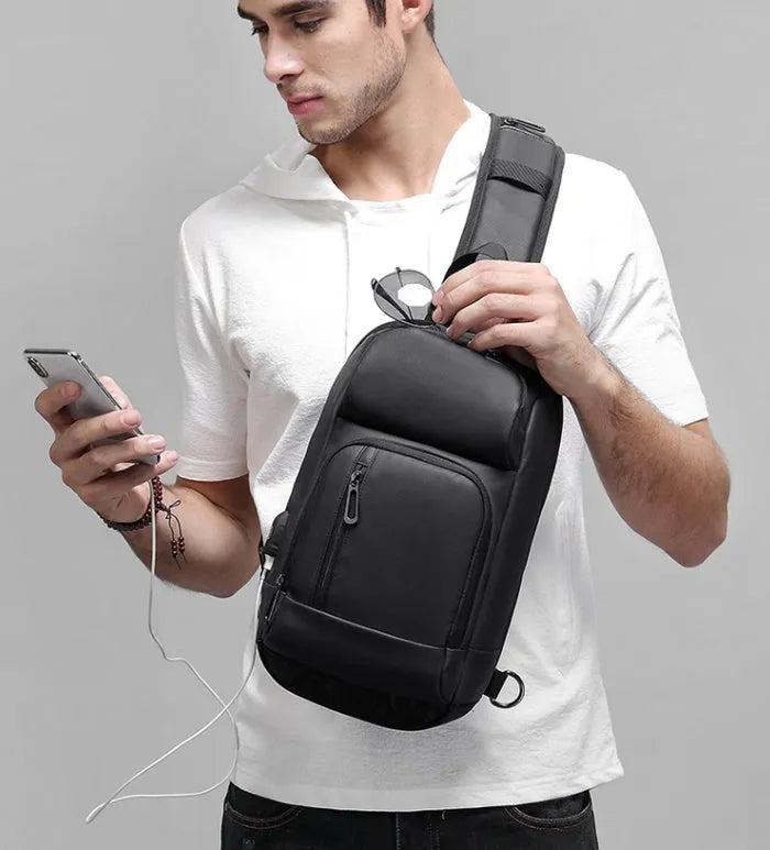 Black medium outdoor shoulder bag with square shape and air cushion strap