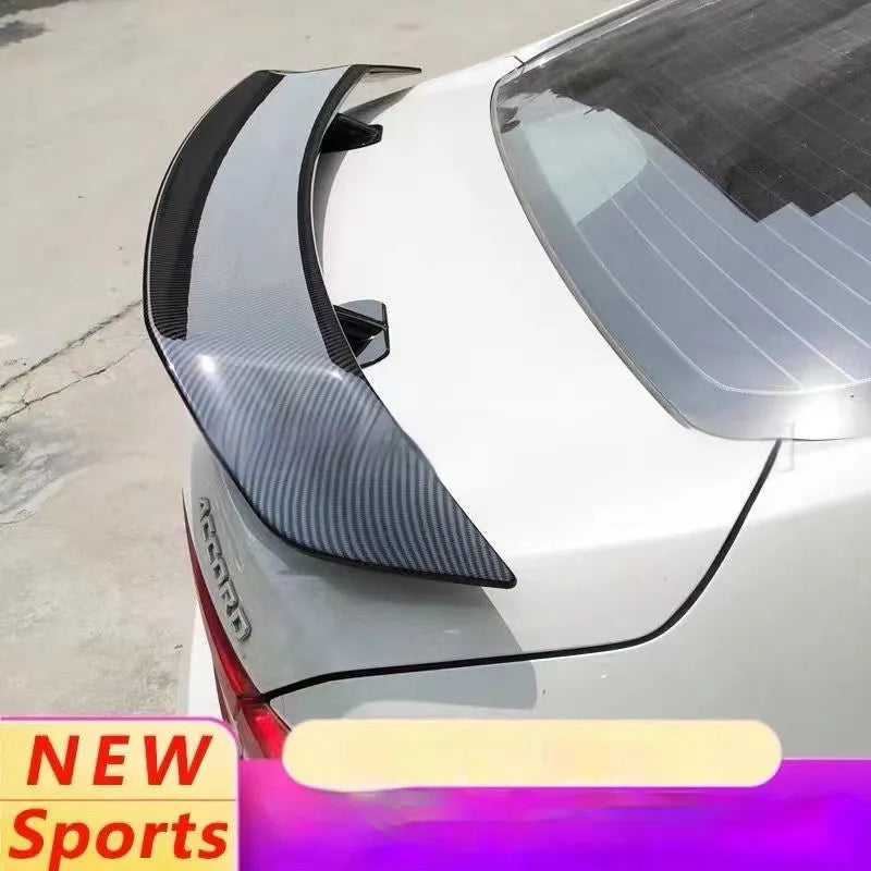 Universal punch-free car spoiler tail wing in ABS plastic on a vehicle.
