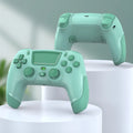 Fruit green wireless Bluetooth game controller for PS4, PC, mobile phone, and Nintendo Switch on a grey background.