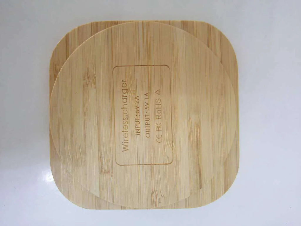 Square wooden bamboo 5W Qi wireless charging pad on a table