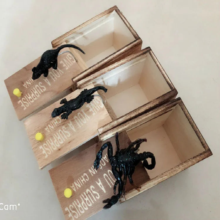 Wooden prank scare box with jumping animal surprise for April Fools' jokes