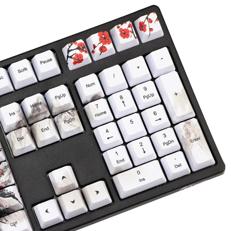 PBT Wangjiang plum blossom theme keycap set with Korean legends on a keyboard.