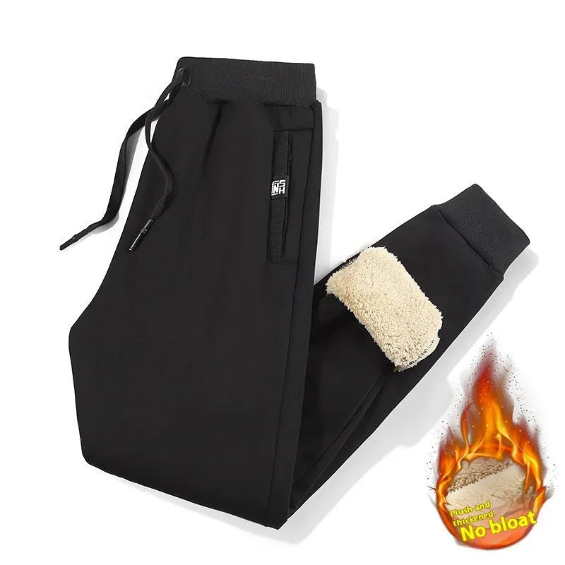 Men's black fleece-lined oversized track pants with drawstring ankles