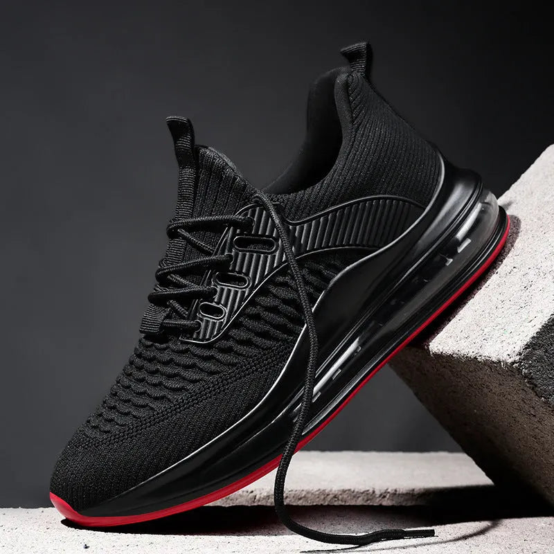 Men's black mesh running shoes with round toe and lace-up front, showing cushion damping sole