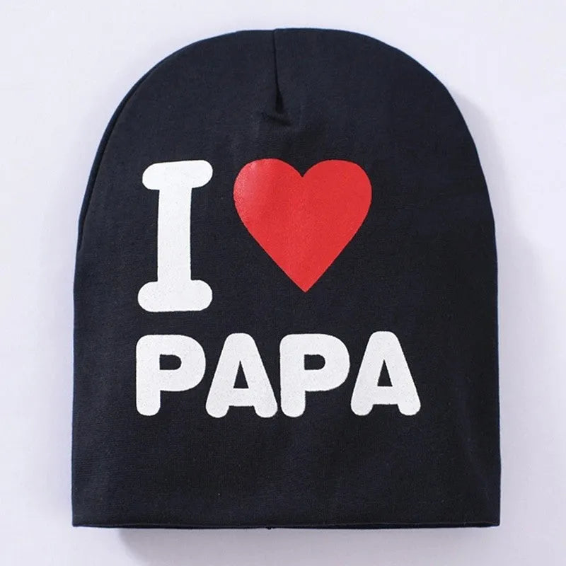 Baby winter hat in grey with 'Love Mama' embroidery, laid flat showing its 20cm height.
