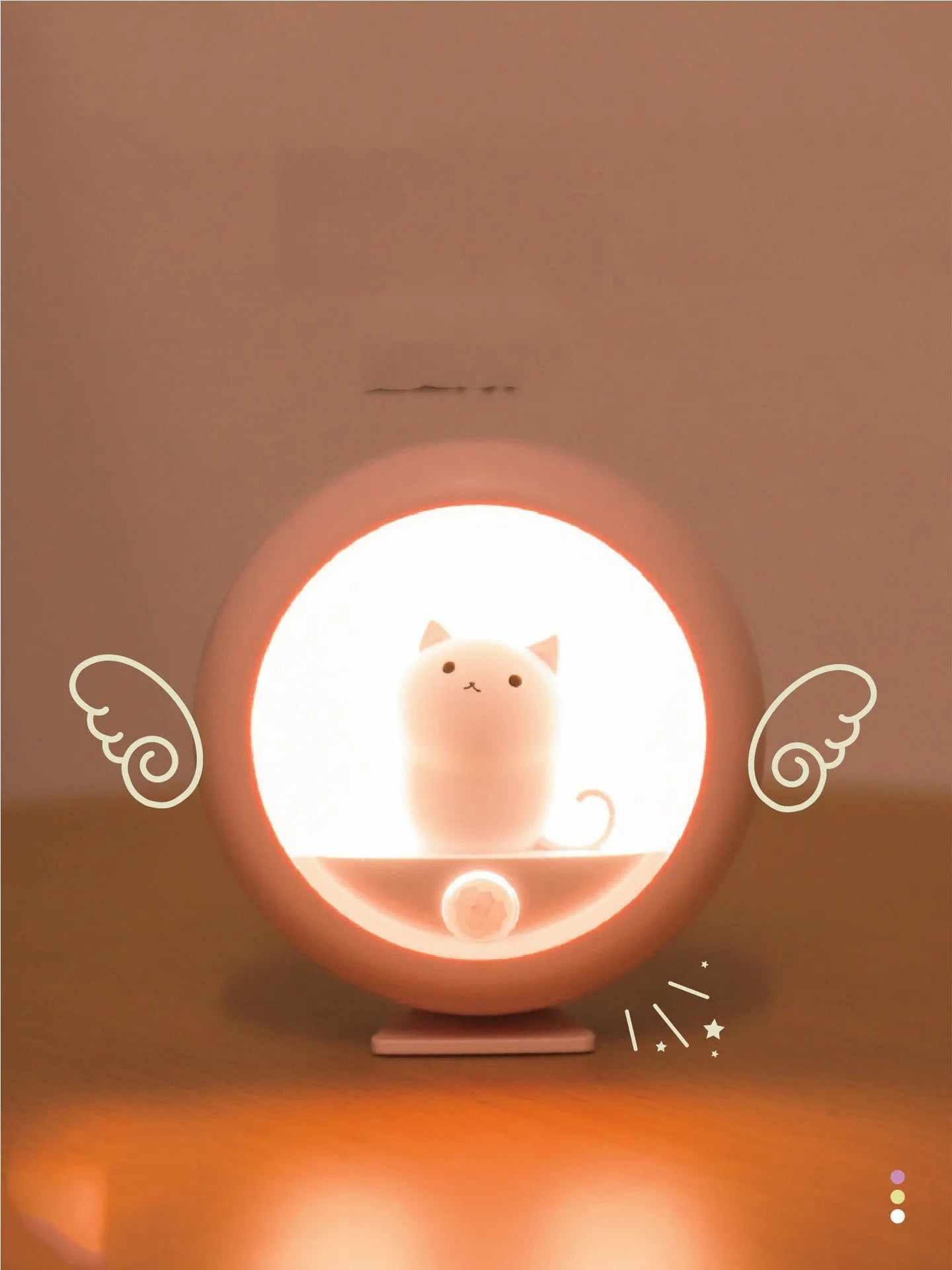 A white bedside sleep lamp for babies with orange, pink, and white light options and a projection feature on a nursery table.