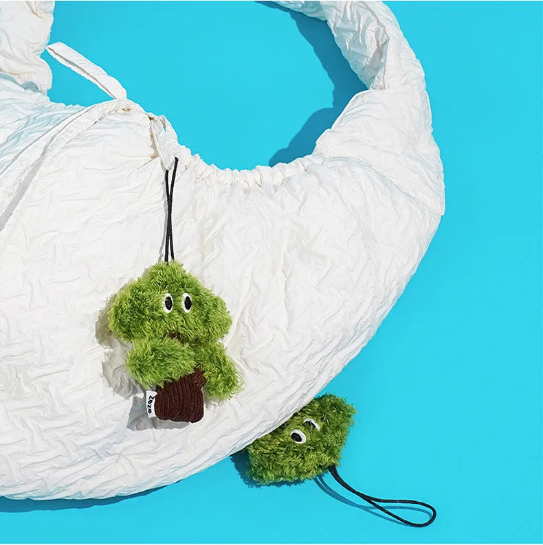 Pine tree-shaped cat toy bag pendant infused with cat mint, shown in three sizes