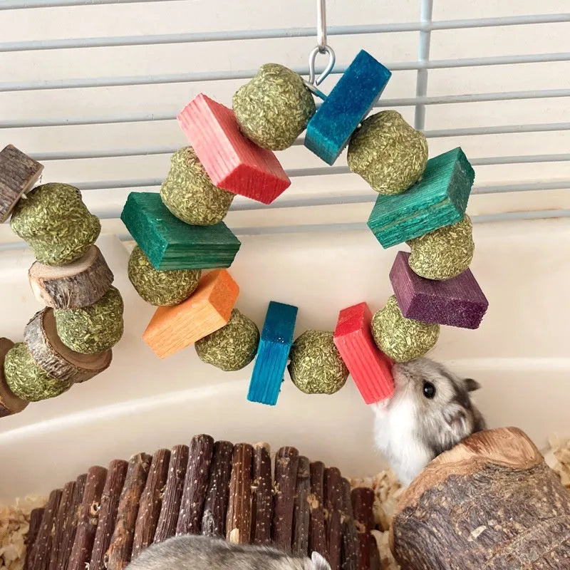 Hamster toy with applewood chew rod and woven straw ball ring for small pet enrichment